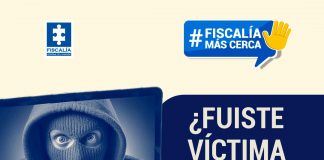 ¿Fuiste víctima de una estafa? ¡Denuncia! Aquí te explicamos cómo hacerlo En la imagen de portada de la sección de redes sociales Fiscalía más cerca se ve un fondo color crema claro con un diseño gráfico de la pantalla de un computador portátil y en la pantalla de este se ve la cara de una persona encapuchada, del dispositivo sobresalen unas manos que teclean en el computador con un titular que dice: ¿Fuiste víctima de una estafa? ¡Denuncia! aquí te explicamos cómo hacerlo.