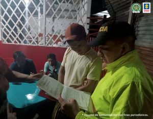 Fiscal Martha Mancera, Martha Mancera, Fiscal Mancera En capturado está custodiado por hombres uniformados de la policía nacional , tiene una gorra anaranjada, con un pendón institucional a la espada del mismo
